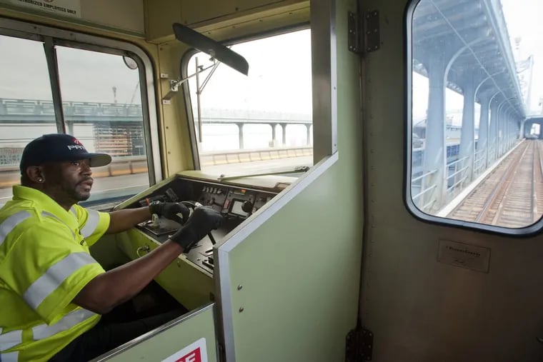 Train operator Robert Blackwell drives PATCO hi-speedline's  "legacy" train over the Ben Franklin Bridge from Camden.  PATCO operated the trains on a special schedule as a farewell for its nostalgic and train enthusiast riders.