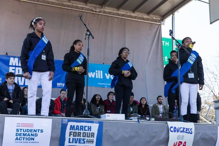 The Earth Day Kids, a group from West Philadelphia, perform at the city’s March for Our Lives rally to call out gun violence.
