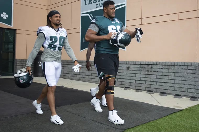 Philadelphia Eagles offensive tackle Jordan Mailata (68) and cornerback Avonte Maddox (29) takes the field during practice at NFL football training camp, Thursday, July 26, 2018, in Philadelphia. (AP Photo/Chris Szagola)