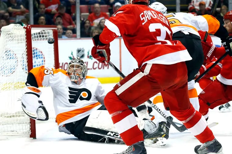 Flyers goalie Steve Mason stops a Detroit shot in the second period.