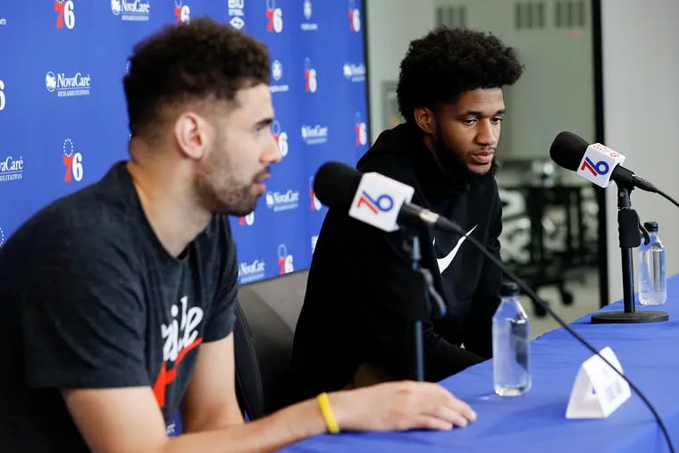 Sixers guard Isaiah Joe (right) listens to teammate Sixers forward Georges Niang answer questions while they meet with the media at the Sixers Training Complex in Camden on Friday, May 13, 2022.