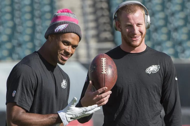 Eagles rookie quarterback Carson Wentz (right) and receiver Jordan Matthews share a laugh before the Vikings game October 23, 2016.