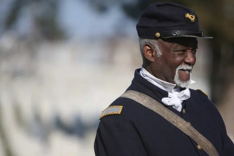 Civll War re-enactor, Joseph Becton listens to the recounting of contributions by US colored troops during the unveiling of historical storyboards at the Philadelphia National Cemetery, 6909 Limekiln Pike, on Monday afternoon, November 27, 2017.
