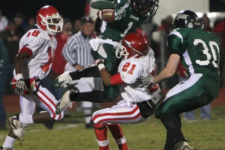 West Deptford&#0039;s Bryan Jackson is lifted by Paulsboro&#0039;s Marcus Gaines last week. Jackson has six touchdowns this season.