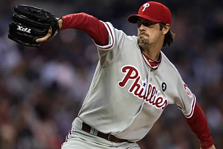 Cole Hamels threw eight scoreless innings against the Padres, striking out eight while allowing four hits. (Lenny Ignelzi/AP Photo)