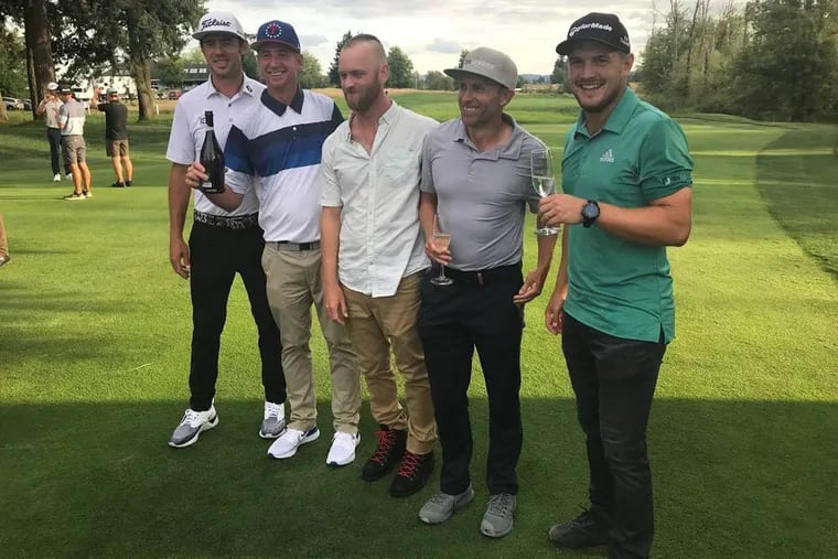 Vince Covello (second from left), a former Delaware County resident who has family in the area, won his PGA Tour card for the 2020 season. Here he celebrates officially "graduating" to the tour after finishing his event Sunday in Portland, Ore.