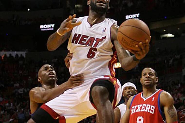 LeBron James scored 32 points and grabbed 10 rebounds against the Sixers on Friday night. (AP Photo)