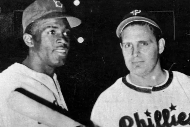 Phillies manager Ben Chapman's verbal abuse of Jackie Robinson (left) earned Chapman a reprimand.