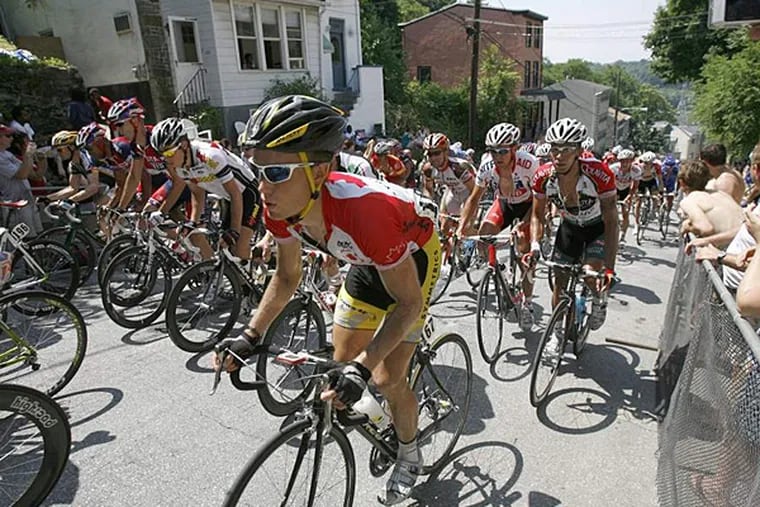 Cyclists race up the Manayunk Wall. (Charles Fox/Staff file photo)