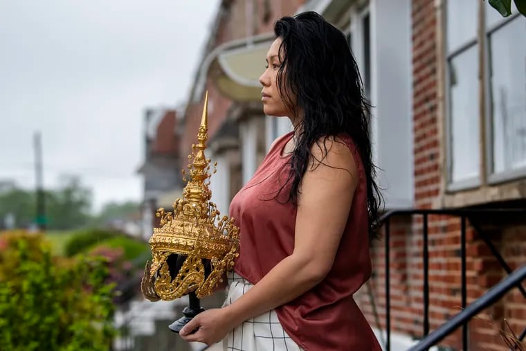 Catzie Vilayphonh is photographed holding a Laos folk crown near her home in Philadelphia, Pa. Friday, May 22, 2020. Vilayphonh is a poet who runs the community arts group Laos in the House.