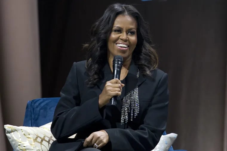 Former first lady Michelle Obama speaks to the crowd as she presents her memoir during her book tour stop in Washington on Nov. 17.
