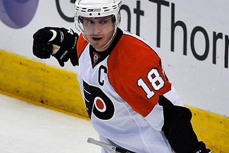 Mike Richards (above) and Blair Betts scored two goals each in the Flyers' win over the Lightning. (Steve Nesius/AP)