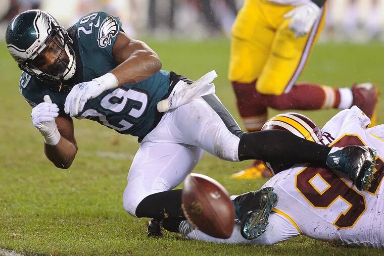 Eagles running back DeMarco Murray (29) fumbles the ball away against the Redskins. (Clem Murray / Staff Photographer)