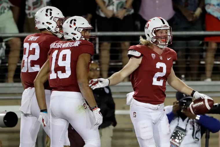 Stanford wide receiver Trenton Irwin (2) celebrates his touchdown catch with teammates J.J. Arcega-Whiteside (19) and Kaden Smith (82) during a game against UCLA in 2017.