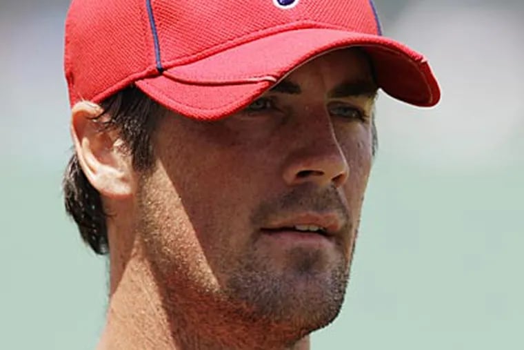 Cole Hamels insists his charitable ties played a significant role in re-signing with the Phillies. (Charles Krupa/AP)