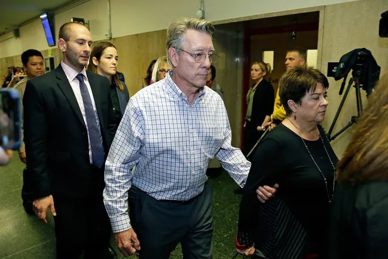 Jim Steinle (center) and Liz Sullivan (right), the parents of Kate Steinle, walk to a courtroom on  Nov. 20, 2017, in San Francisco.