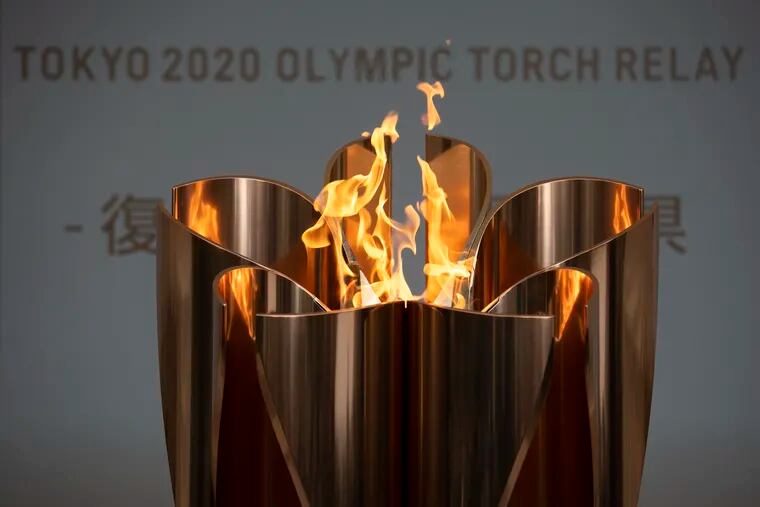 The Olympic Flame burns during a ceremony in Fukushima City, Japan.