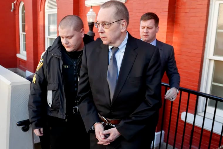 David Lee Poulson, a Roman Catholic priest who pleaded guilty to sexually abusing two boys, is taken away from court after sentencing on Friday, Jan. 11, 2019 in Brookville, Pa.