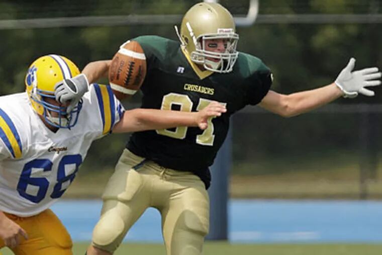 Lansdale Catholic's Patrick O'Hara (right) competed against Downingtown East last month. Tonight, O'Hara and the Crusaders will make their Catholic League debut, but they will face a North Catholic team that has won three straight games. (Ron Cortes / Inquirer)