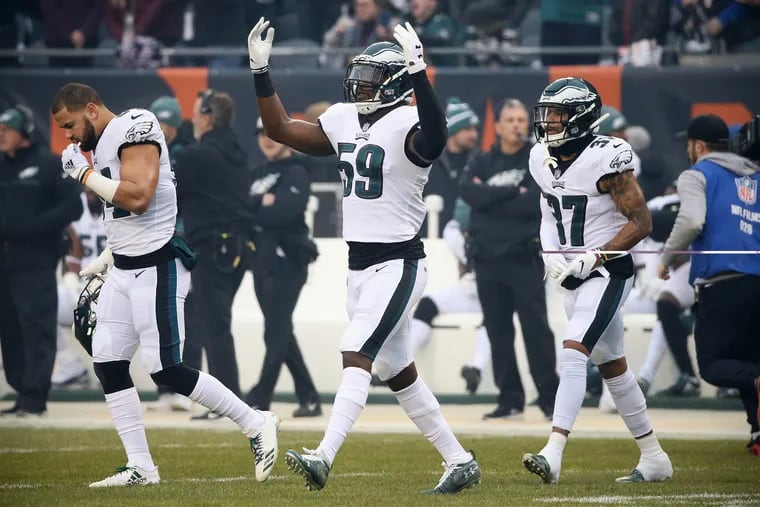Eagles linebacker B.J. Bello (59), motioning to the crowd before the January playoff game against the Bears, has been waived.