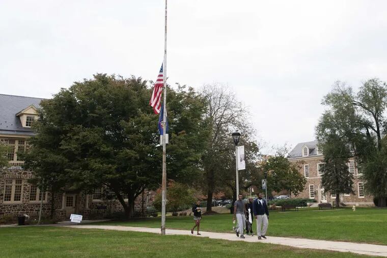 File: Students walking across campus at Cheyney University.