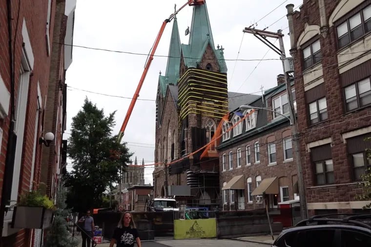 This image from an Inquirer video shows the start of demolition of the twin spires of St. Laurentius Church in Fishtown in mid-August.
