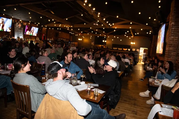 A packed house of customers watches intently during the weekly watch party for "The Bachelor" at Urban Saloon in Fairmount on March 18.