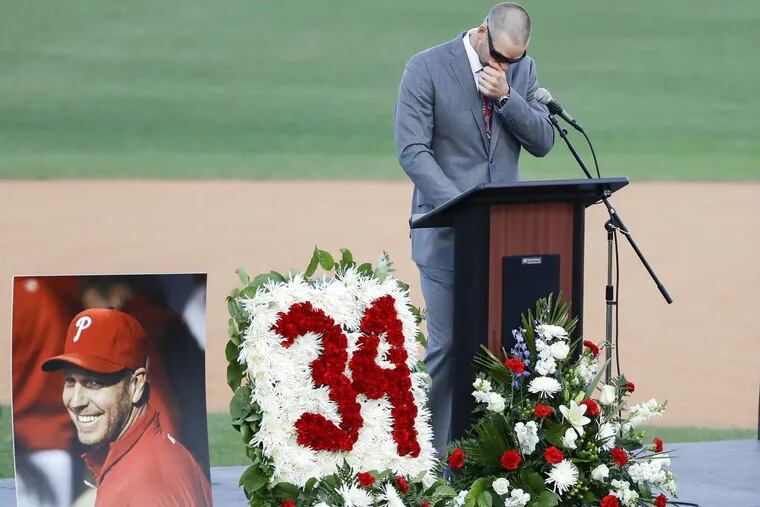 Former MLB pitcher and teammate of Roy Halladay, Chris Carpenter wipes his face during a Celebration of Life for Roy Halladay at Spectrum Field in Clearwater, Florida on Tuesday, November 14, 2017. YONG KIM / Staff Photographer