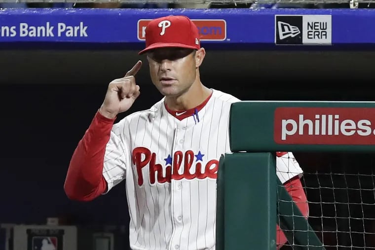 Phillies manager Gabe Kapler gives signs against the marlins on Sept. 14.