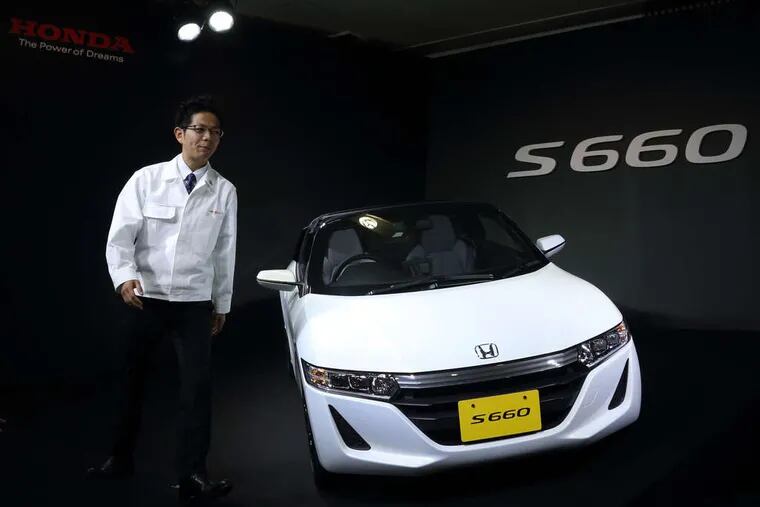 At the Tokyo unveiling of Honda's S660 roadster, engineer Ryo Mukumoto walks by what was once just a vision of his. Mukumoto, 26, was the youngest lead engineer in Honda history and he had a young team to help. &quot;People of my generation think cars are simply a tool for transportation,&quot; said Mukumoto, 26. &quot;I wanted them to say: 'Hmm, this car is different.' We have made a car that will turn heads.&quot; It goes on sale next month in Japan.
