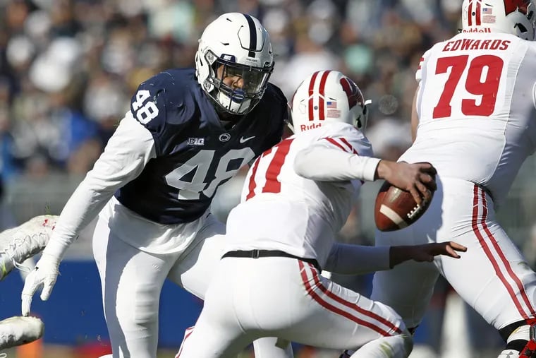 Penn State's Shareef Miller (48) moves in to sack Wisconsin quarterback Jack Coan.