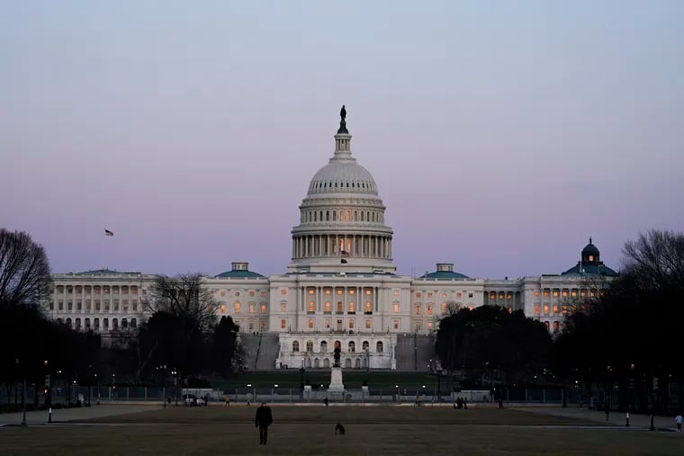 The U.S. Capitol building is shown after sunset Thursday in Washington.