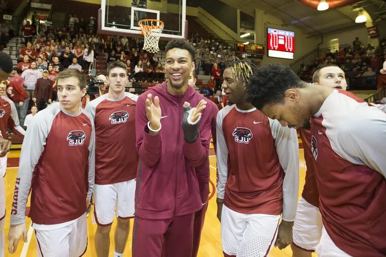 Charlie Brown (center) will join his Hawks' teammates on the floor at Hagan Arena for the season opener on Nov. 9 — his first game since the end of the 2016-17 season.