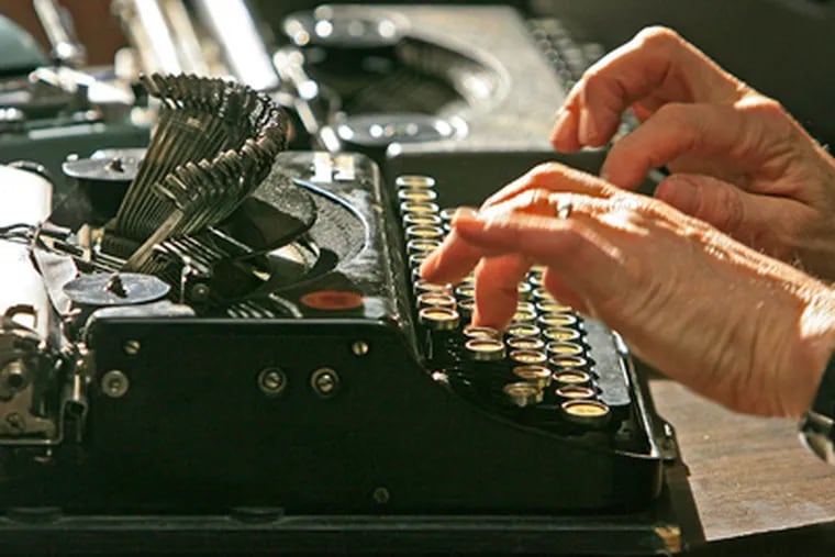 Michael McGettigan, 56, types using a typewriter. (Akira Suwa / Staff Photographer)