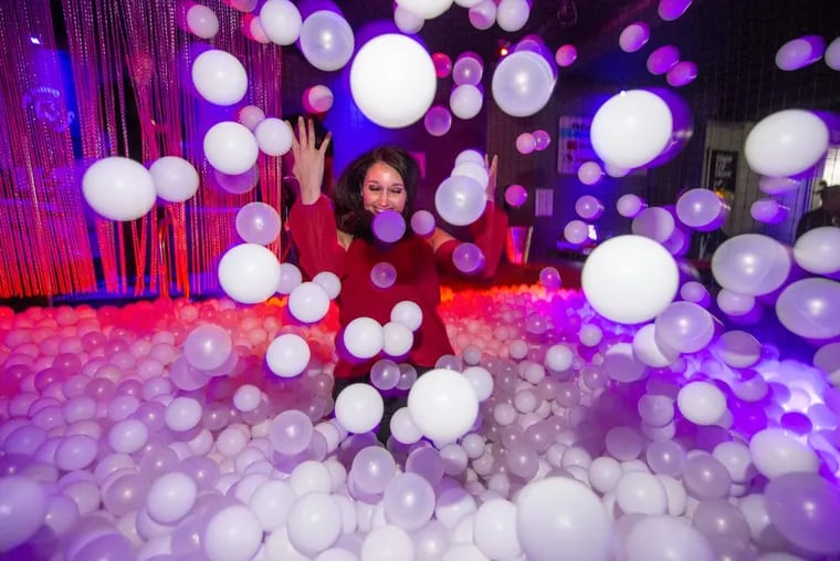 A young woman enjoys herself in the ball pit in the Concourse Dance Bar.