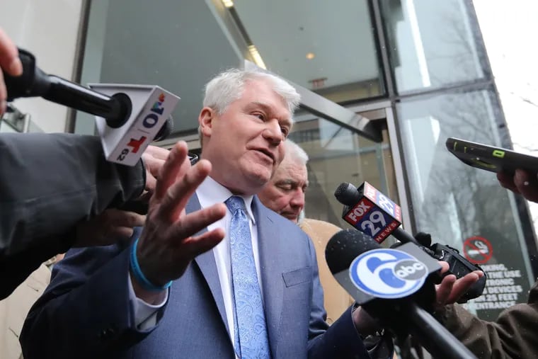 In a file photo, Labor leader John "Johnny Doc" Dougherty talks to reporters while leaving the federal courthouse in Philadelphia after pleading not guilty to federal criminal charges on Feb. 1, 2019.