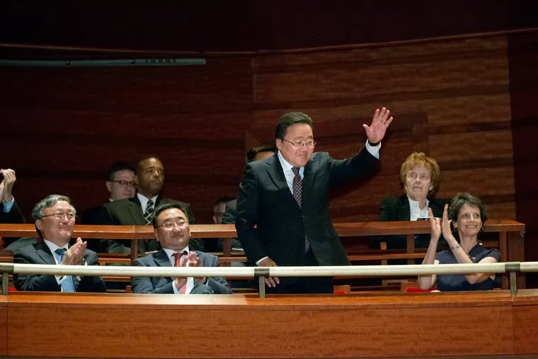 Mongolian President Tsakhiagiin Elbegdorj acknowledges applause at the start of a special concert at the Kimmel Center. The orchestra will visit his country next June as part of an Asian tour.