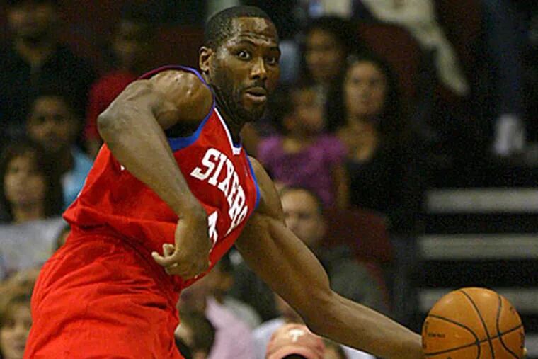 Elton Brand tries to save the ball from going out of bounds during the Sixers 90-89 loss to the Nets. (AP Photo/Rich Schultz)