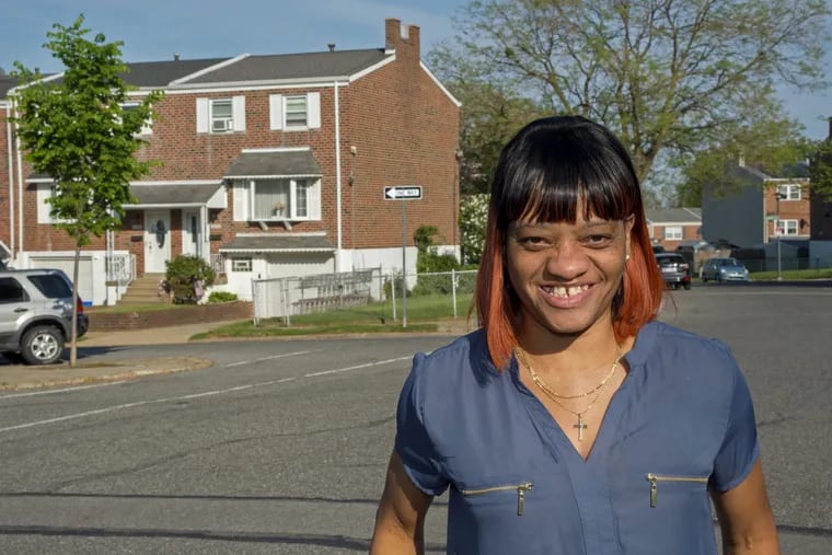 Rhonda Washington outside her home in the Northeast. A recent change to the Housing Choice Voucher Program, formerly known as Section 8, could mean more people moving into “higher opportunity” neighborhoods or out to the suburbs.