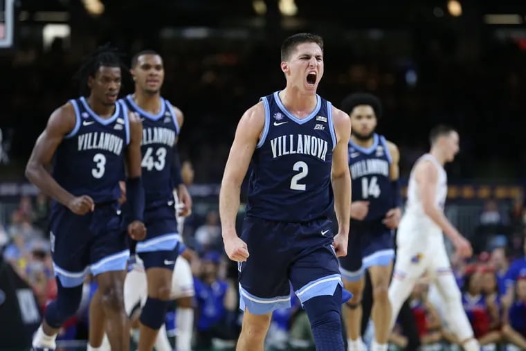 Collin Gillespie of Villanova celebrates after hitting a three-pointer against  Kansas during the first half.