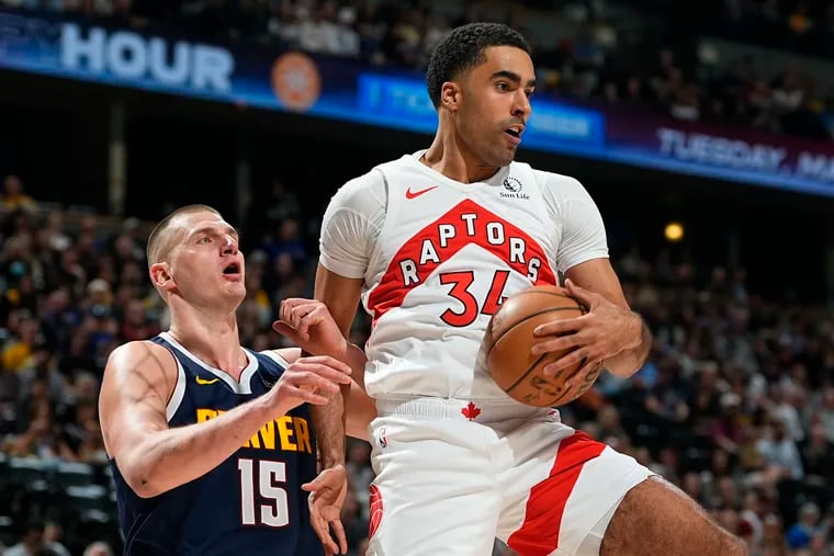 Raptors center Jontay Porter, right, shown during a March 11 game against the Nuggets.
