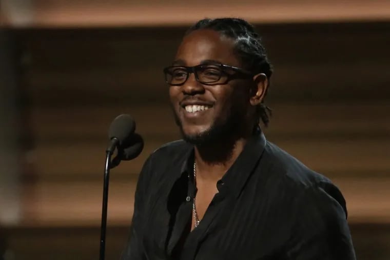 Kendrick Lamar accepts his Grammy for Best Rap Album at the 58th Annual Grammy Awards on Monday, Feb. 15, 2016, at the Staples Center in Los Angeles.
