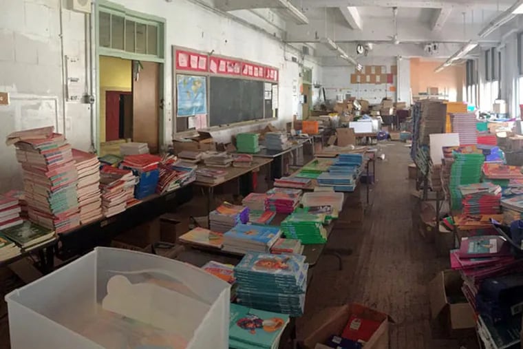 Thousands of left-behind books from closed schools fill the classrooms and hallways of shuttered Bok High School in South Philadelphia.