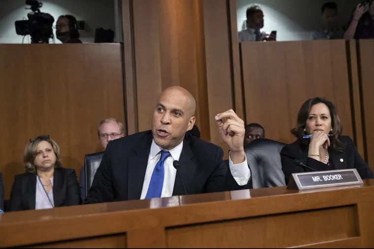 Sen. Cory Booker (D., N.J.) and Sen. Kamala Harris (D., Calif.), right, and other Democrats on the Senate Judiciary Committee appealed to Chairman Chuck Grassley, (R., Iowa), to delay the confirmation hearing of President Donald Trump's Supreme Court nominee, Brett Kavanaugh, on Capitol Hill in Washington, Tuesday.