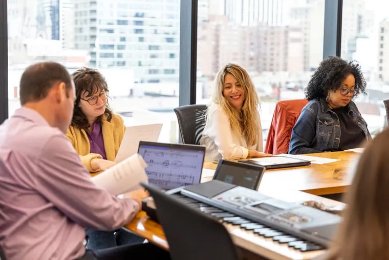 Krista Bortolato (center), human resources leader with Aramark, at an InTune employee choir rehearsal at the company's headquarters in Philadelphia.