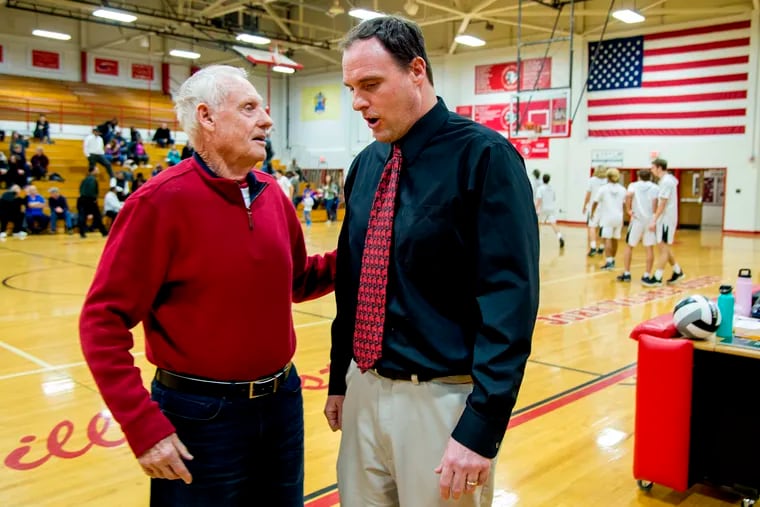 Former Haddonfield basketball coach Dave Wiedeman (left) talks with his son, the current Haddonfield coach Paul Wiedeman (right) before game vs. Burlington City at Cherry Hill East.