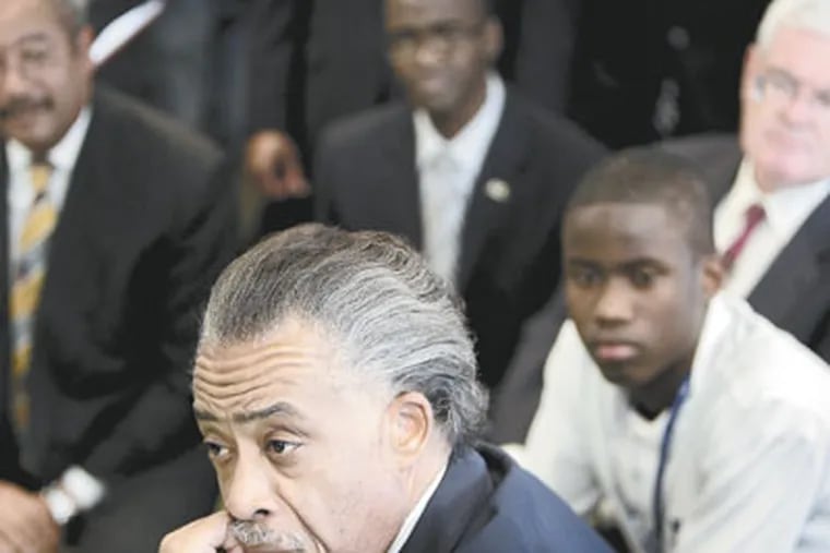 Civil rights leader Al Sharpton, left, listens as students talk during a class at the Mastery Charter School in Philadelphia. ( David Maialetti / Staff Photographer )