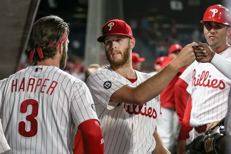 Phillies pitcher Zack Wheeler, center, will start the opener of a three-game series in Milwaukee on Monday.