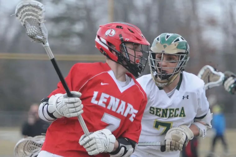 Lenape's Zach Cole tries to maneuver around Nick George during the Indians' 6-5 victory.