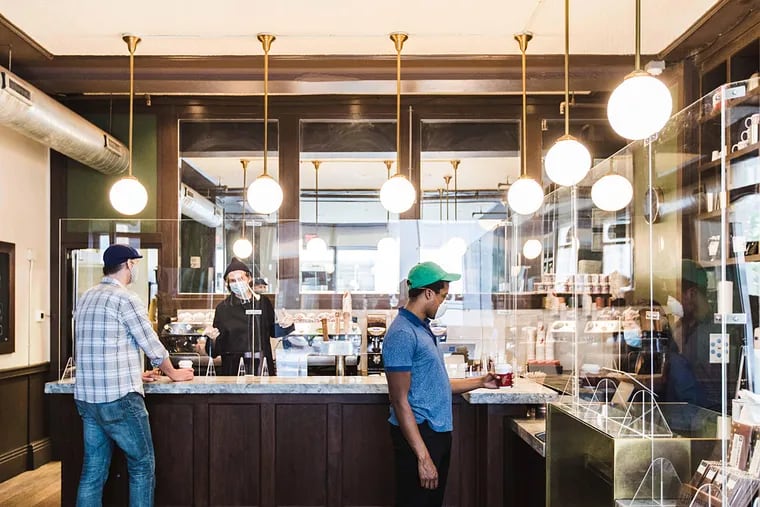 The Rittenhouse Square location of La Colombe has been outfitted to comply with new health standards. Acrylic glass shields frame the counter.